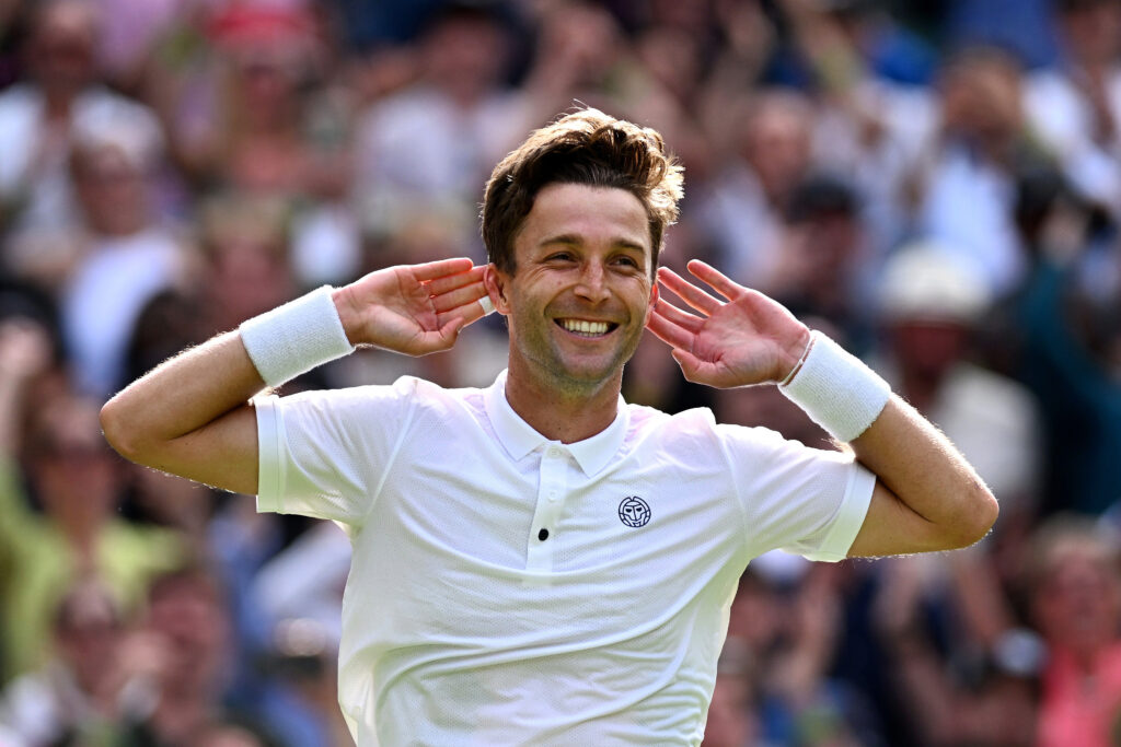 LONDON, ENGLAND - JULY 06: Liam Broady of Great Britain celebrates winning match point against Casper Ruud of Norway in the Men's Singles second round match during day four of The Championships Wimbledon 2023 at All England Lawn Tennis and Croquet Club on July 06, 2023 in London, England.