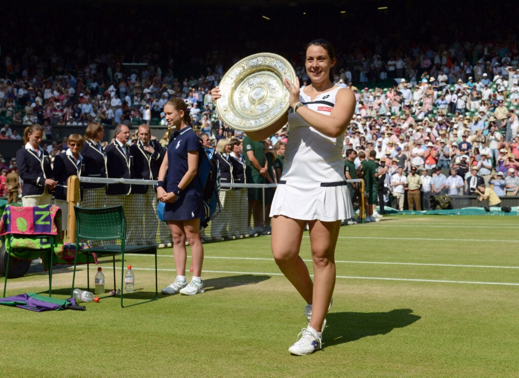 Marion Bartoli shows off her Wimbledon trophy