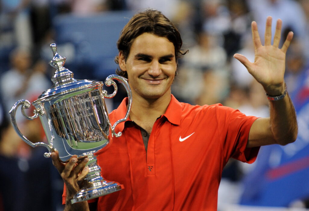 Roger Federer (R) of Switzerland celebrates victory over Andy Murray of Great Britain in the men's final at the US Open tennis tournament September 8, 2008 in New York. Federer won 6-2, 7-5, 6-2.