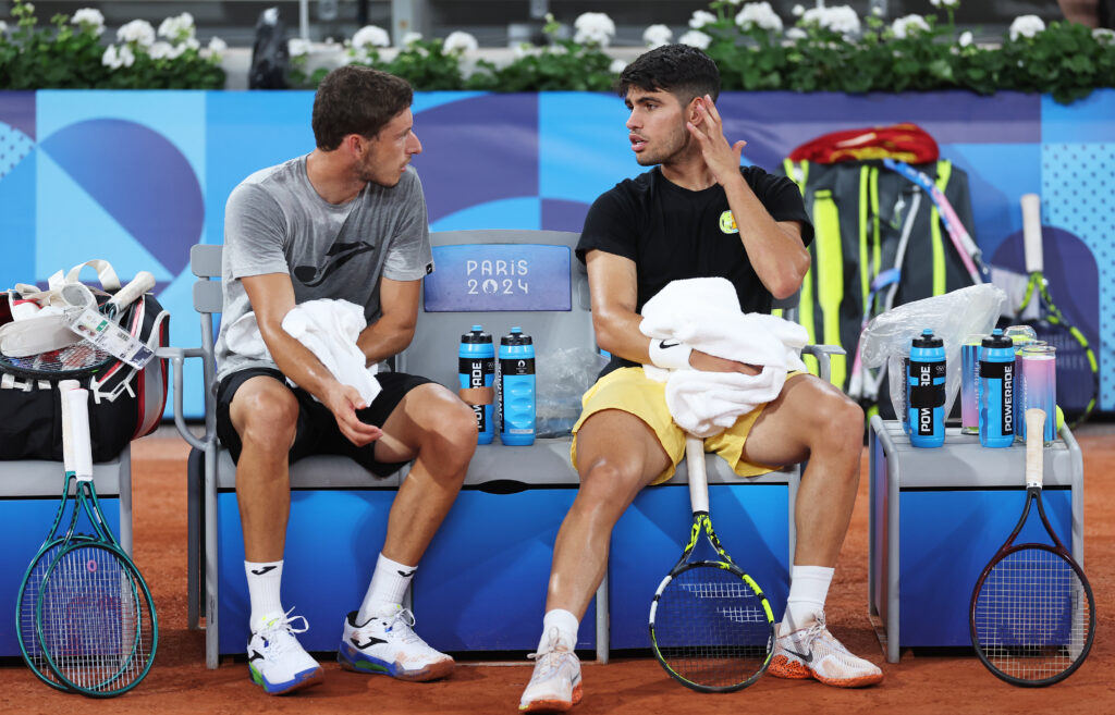 Pablo Carreno Busta and Carlos Alcaraz of Team Spain interact during a tennis training session at Roland-Garros ahead of the Paris Olympic Games on July 23, 2024 in Paris, France.