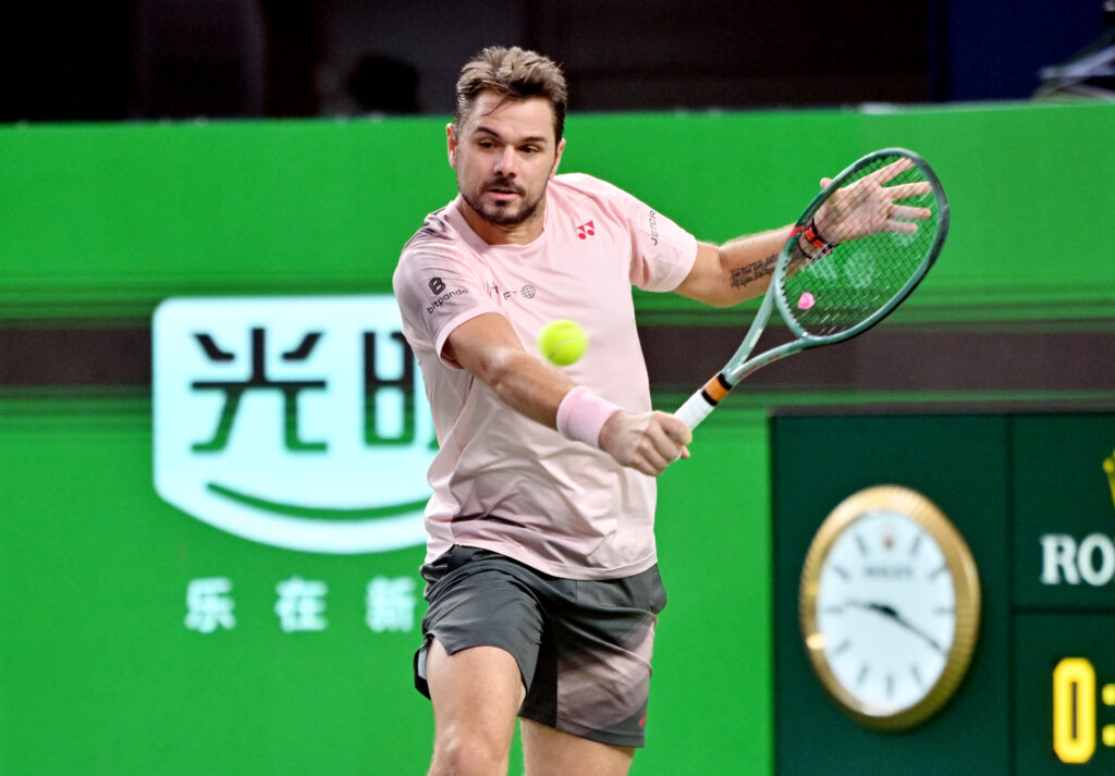 Stanislas Wawrinka of Switzerland hits a return in the Men's Singles Round of 64 match against Flavio Cobolli of Italy on Day 8 of 2024 Shanghai Rolex Masters at Qi Zhong Tennis Centre on October 7, 2024 in Shanghai, China.
