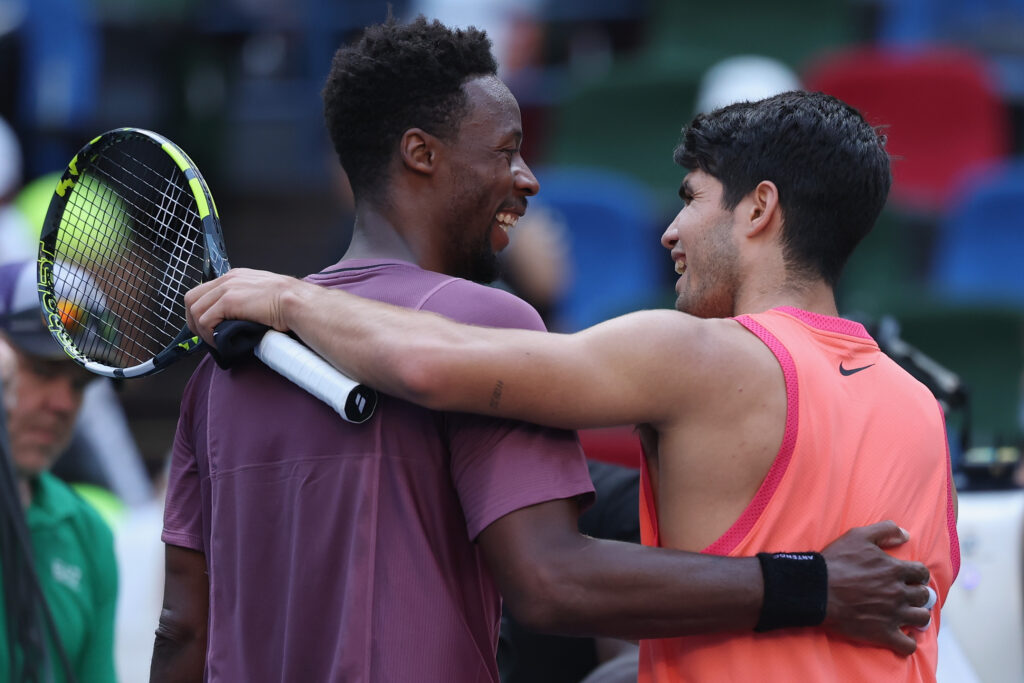 Carlos Alcaraz of Spain and Gael Monfils of France shake hands at the net after the Men's singles fourth round match against on Day 10 of 2024 Shanghai Rolex Masters at Qi Zhong Tennis Centre on October 09, 2024 in Shanghai, China.