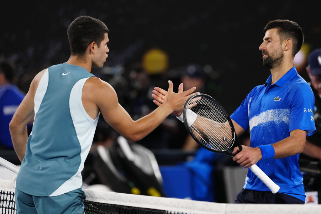 Carlos Alcaraz and Novak Djokovic shake hands