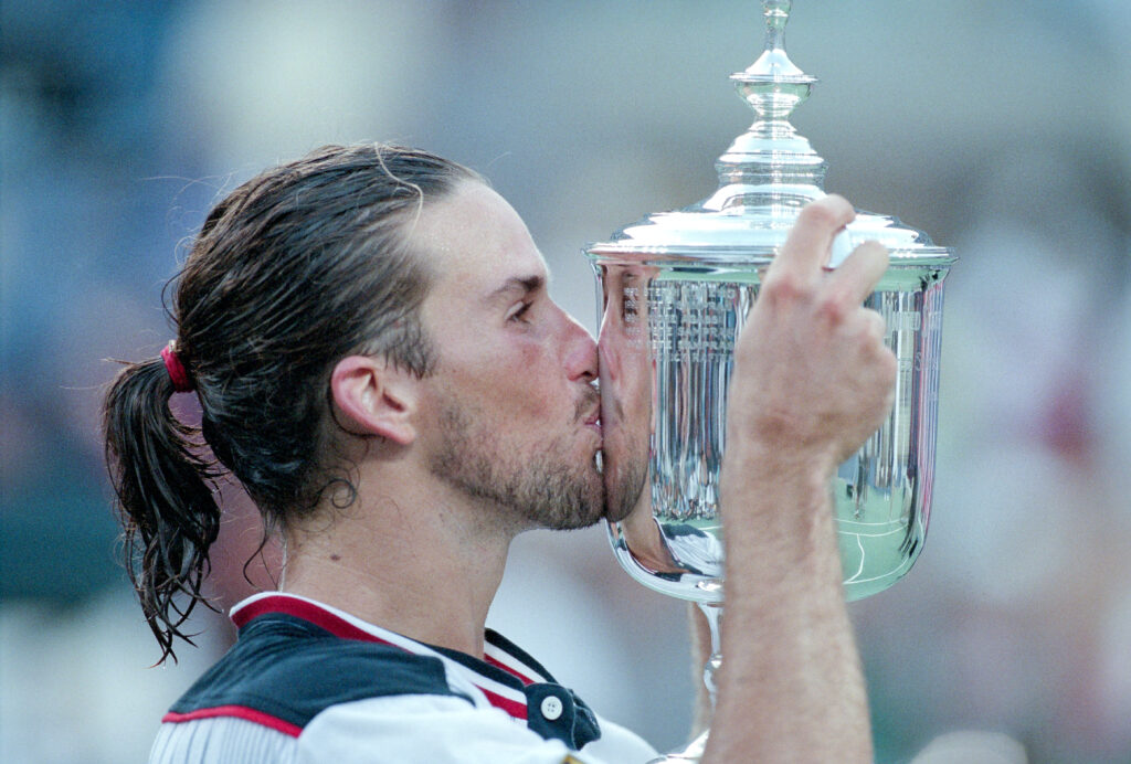 Patrick Rafter of Australia kisses the trophy after defeating Mark Philippoussis of Australia during the Men's Singles Final at United States Open in Flushing, New York on September 13th, 1998 in New York, United States of America.