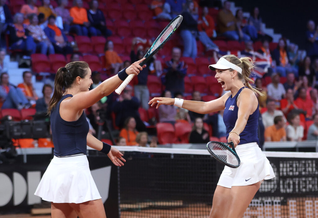 Jodie Burrage and Katie Boulter of Great Britain celebrate match point as they play doubles against Demi Shuurs and Suzan Lamens of the Netherlands during the Billie Jean King Cup Qualifier match between Great Britain and Netherlands at Sportcampus Zuiderpark on April 12, 2025 in The Hague, Netherlands.