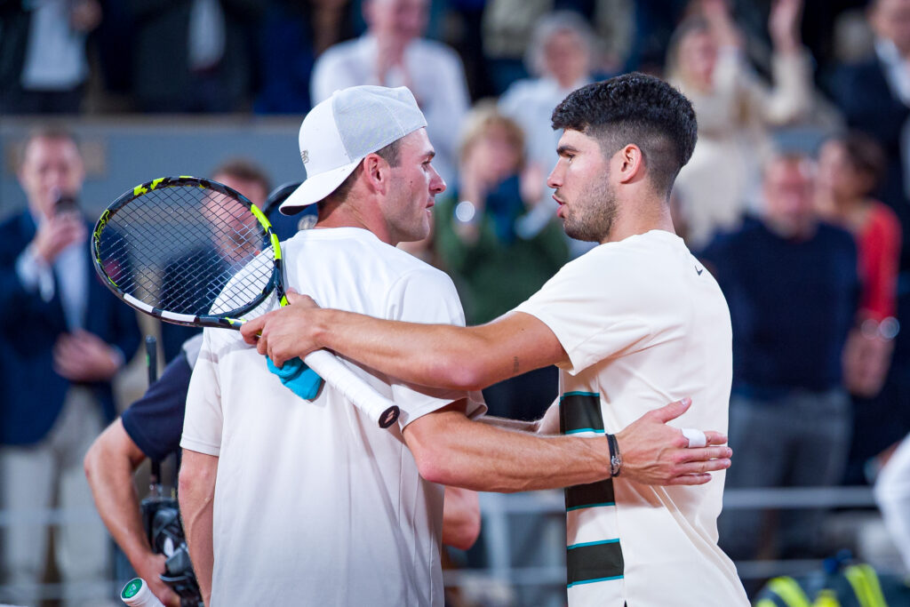 Carlos Alcaraz (R) of Spain shakes hands with Tommy Paul of United States at the net after his victory during the Men's Singles Quarter Final match on Day Ten of the 2025 French Open at Roland Garros on June 03, 2025 in Paris, France.