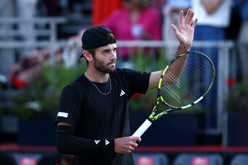 Jacob Fearnley of Great Britain acknowledges the crowd following victory over Alex Bolt of Australia during the Men's Singles First Round match on Day Eight of the 2025 HSBC Championships at The Queen's Club on June 16, 2025 in London, England.