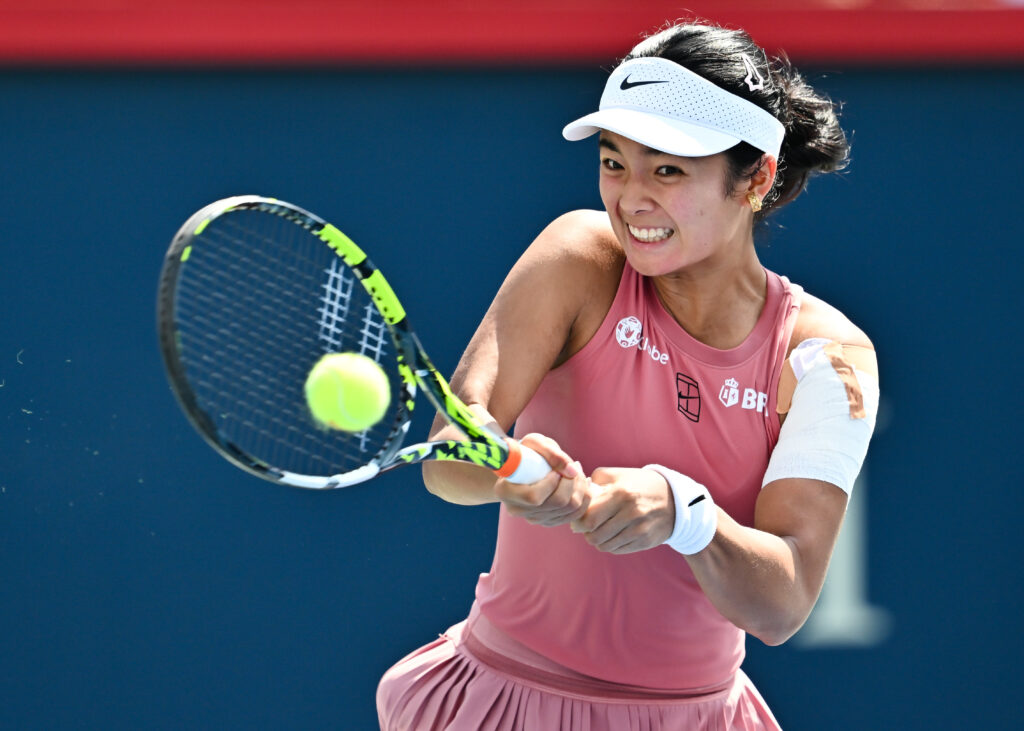Alexandra Eala of the Philippines plays a backhand against Marketa Vondrousova of Czechia during their first round match on Day One of the WTA 1000 National Bank Open at IGA Stadium on July 27, 2025 in Montreal, Quebec, Canada.