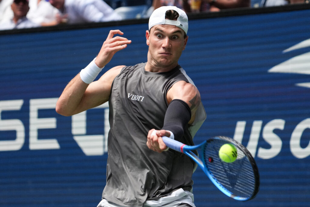 Britain's Jack Draper plays a return to Argentina's Federico Agustin Gomez during their men's singles first round tennis match on day two of the US Open tennis tournament at the USTA Billie Jean King National Tennis Center in New York City, on August 25, 2025