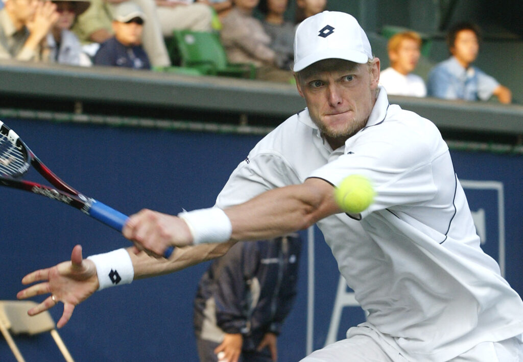 Kenneth Carlsen of Denmark sets to returns the ball in the men's singles semifinal match against Paradorn Srichaphan of Thailand at the Japan Open tennis tournament in Tokyo, 05 October 2002. Carlsen beat Srichaphan with a 7-6 (7/4), 7-6 (7/5). Carlsen cast a damper on Paradorn Srichaphan's overnight celebrity by eliminating the last seeded player in the singles field to reach the final at the Japan Open tennis tournament.