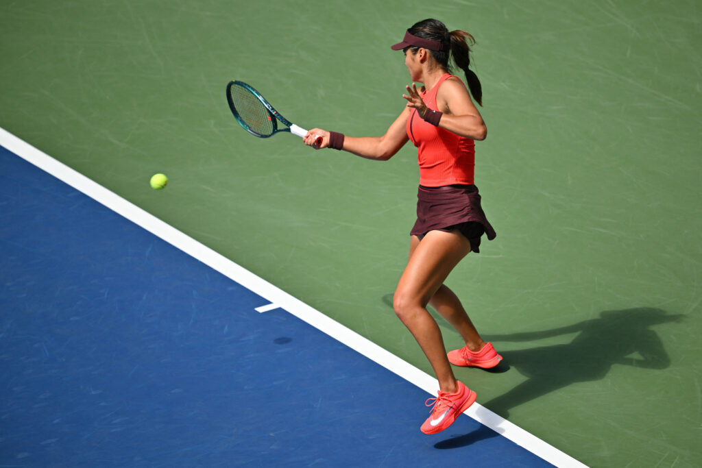 Emma Raducanu hits a forehand