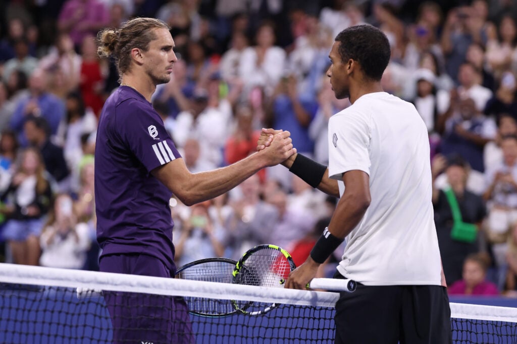 Felix Auger-Aliassime of Canada (R) greets Alexander Zverev of Germany following their Men's Singles Third Round match on Day Seven of the 2025 US Open at USTA Billie Jean King National Tennis Center on August 30, 2025 in the Flushing neighborhood of the Queens borough of New York City.