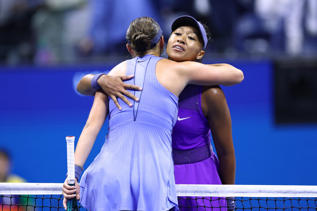 Japan's Naomi Osaka (R) hugs USA's Amanda Anisimova after losing their women's singles semifinal tennis match on day twelve of the US Open tennis tournament at the USTA Billie Jean King National Tennis Center in New York City, on September 4, 2025.