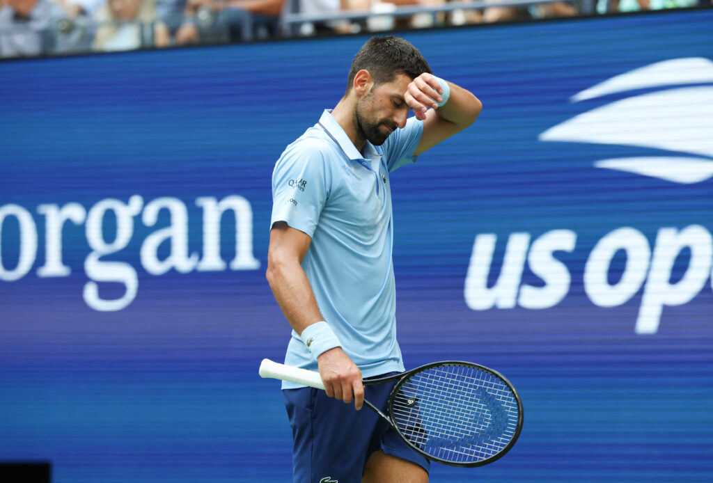 Novak Djokovic wipes his brow