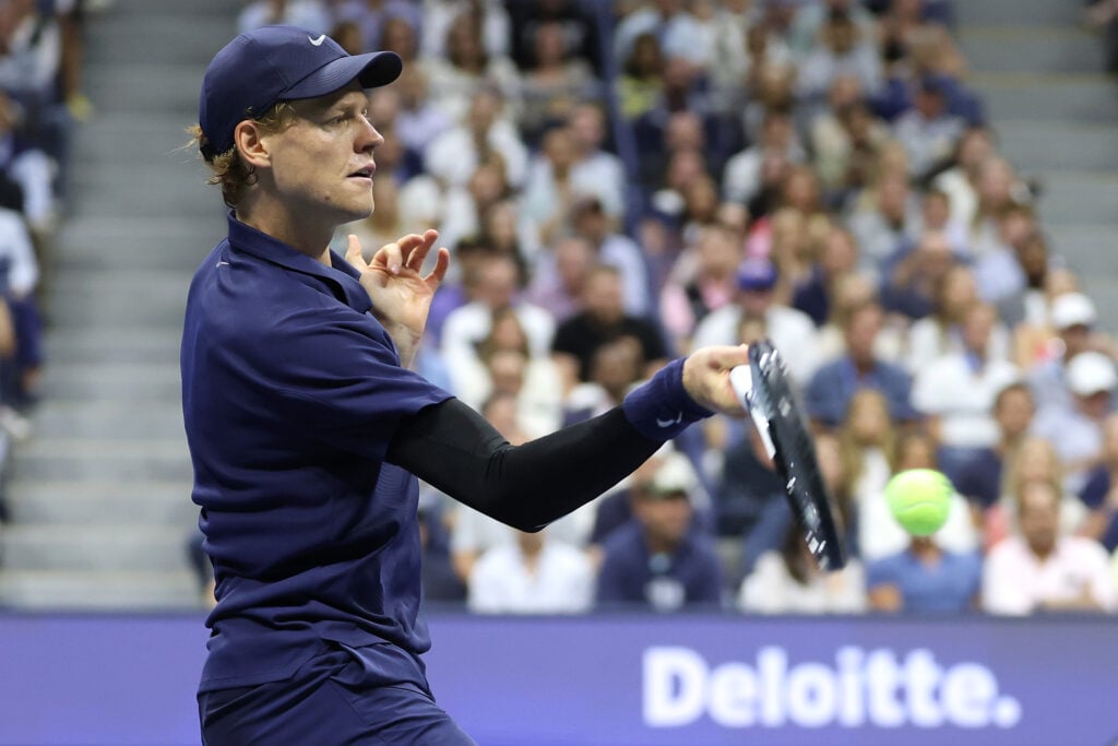 Jannik Sinner hits a forehand