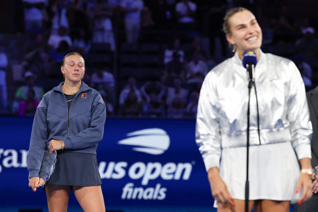USA's Amanda Anisimova (L) reacts as Belarus's Aryna Sabalenka accepts the trophy after winning their women's singles final tennis match on day fourteen of the US Open tennis tournament at the USTA Billie Jean King National Tennis Center in New York City, on September 6, 2025.