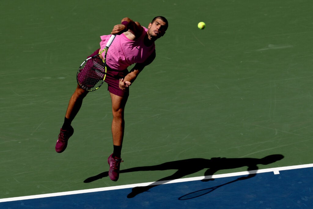 Carlos Alcaraz serves