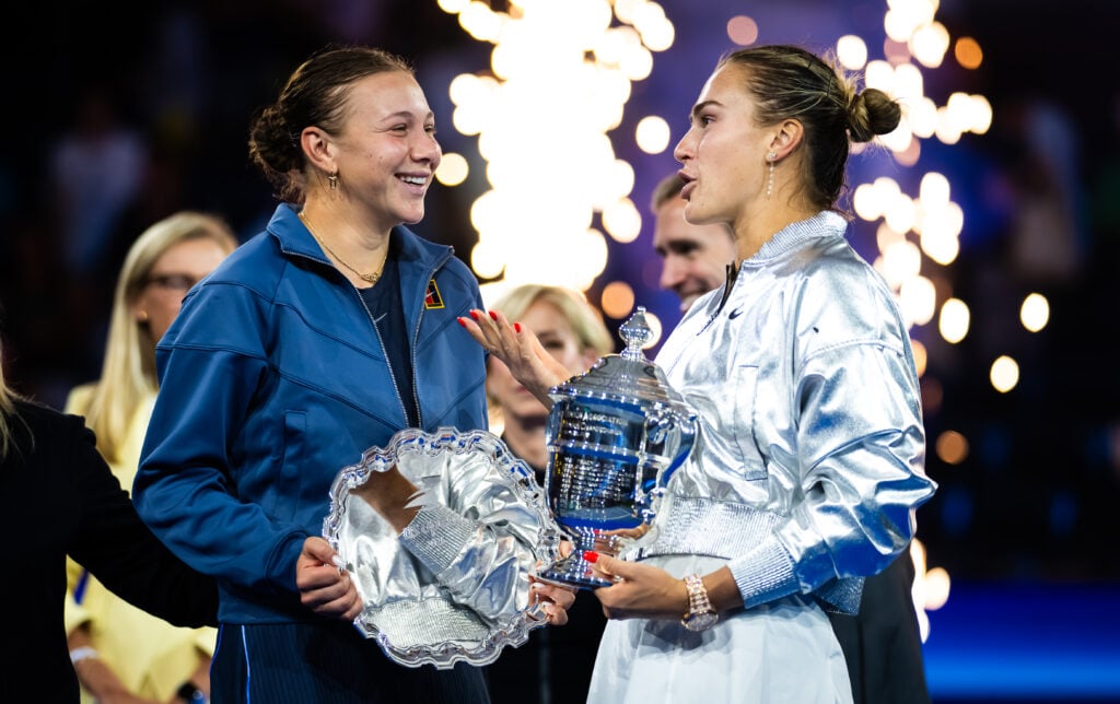 Amanda Anisimova and Aryna Sabalenka chat with their trophies