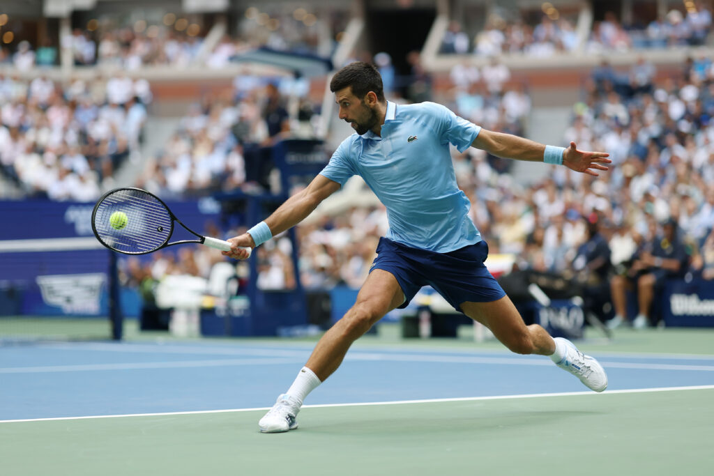 Novak Djokovic hits a backhand