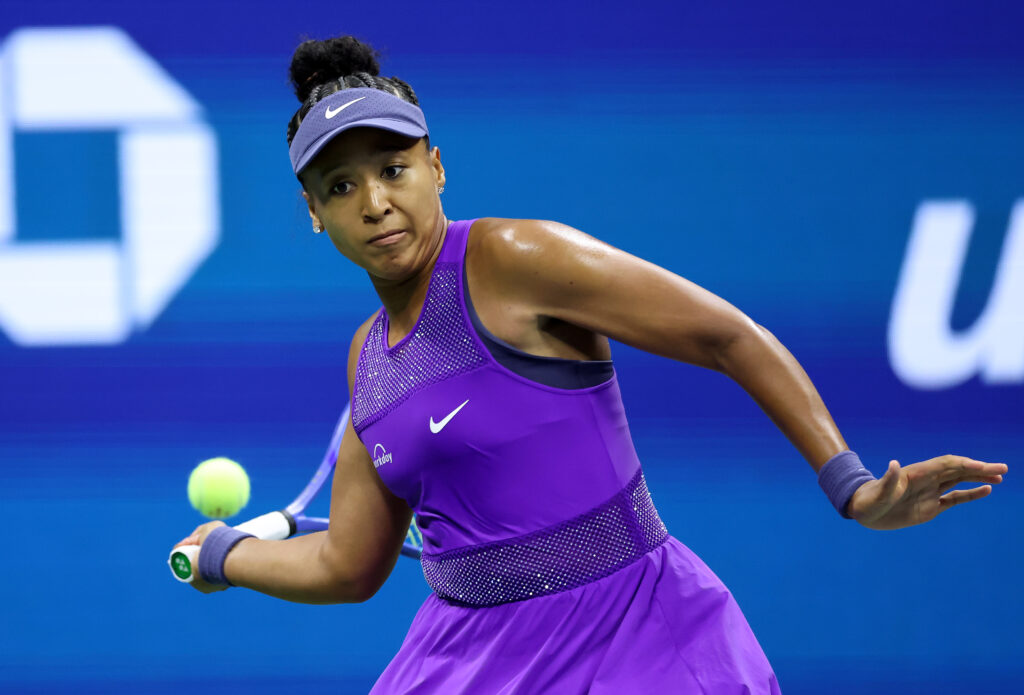 Naomi Osaka of Japan returns a shot against Amanda Anisimova of the United States during their Women's Singles Semifinal match on Day Twelve of the 2025 US Open at USTA Billie Jean King National Tennis Center on September 4, 2025 in the Flushing neighborhood of the Queens borough of New York City