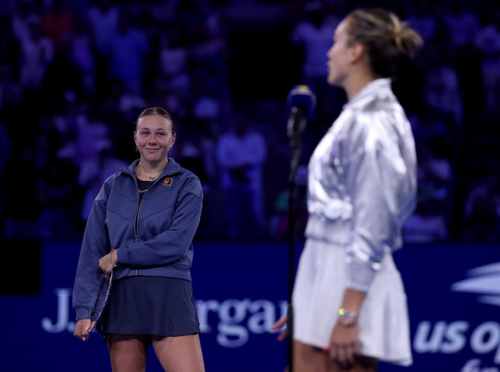Amanda Anisimova of the United States reacts as Aryna Sabalenka addresses the crowd after the Women's Singles Final match on Day Fourteen of the 2025 US Open at USTA Billie Jean King National Tennis Center on September 06, 2025 in New York City. Sabalenka defeated Amanda Anisimova 6-3,7-6 to claim the US Open title.