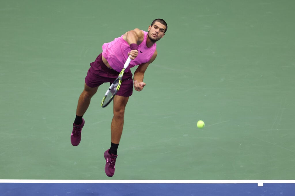 Carlos Alcaraz serves