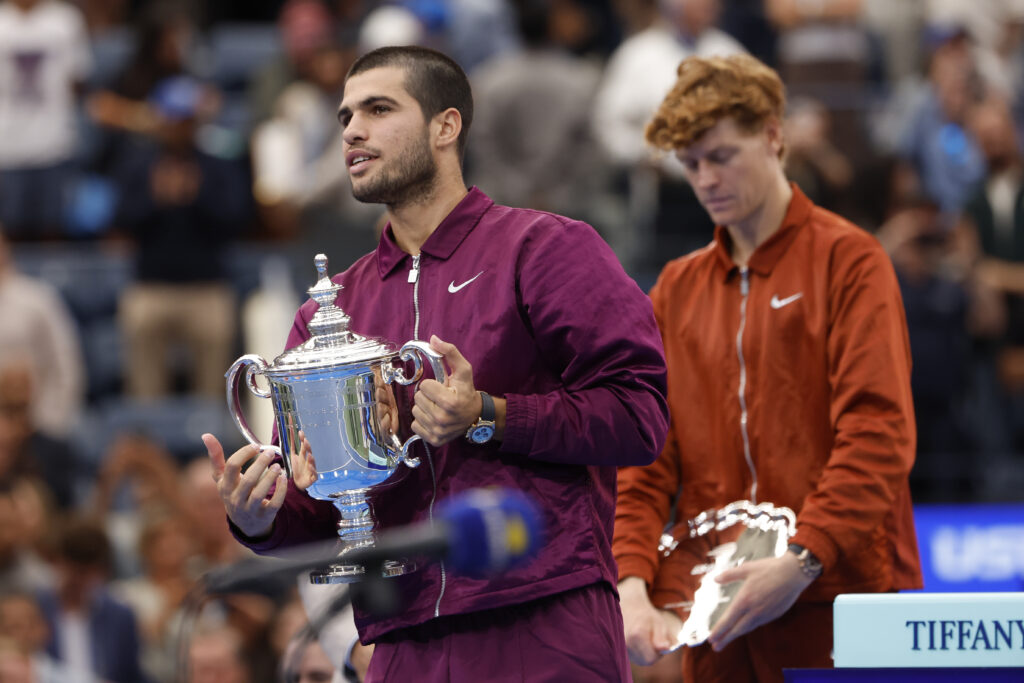 Winner Carlos Alcaraz of Spain, finalist Jannik Sinner of Italy during the podium ceremony following the Men's Singles Final match on day fifteen of the 2025 US Open Tennis Championships at USTA Billie Jean King National Tennis Center on September 7, 2025 in Flushing Meadows, Queens, New York City.