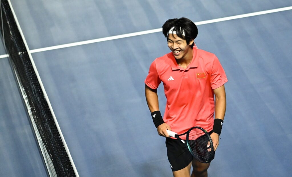 Yi Zhou of China PR celebrates during the singles match against Michael Agwi of Ireland on day one of the Davis Cup World Group II match between Ireland and China PR at the Sport Ireland National Indoor Arena in Dublin.
