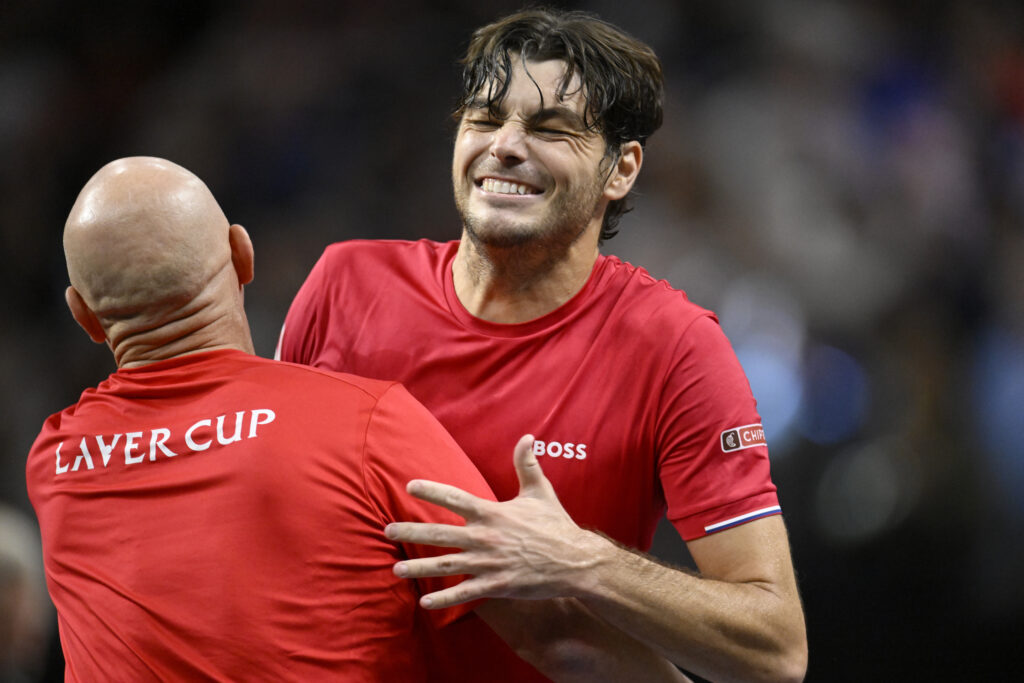 Taylor Fritz of Team World (R) celebrates with Team World Captain Andre Agassi after defeating Carlos Alcaraz of Team Europe during day two of Laver Cup 2025 at Chase Center on September 20, 2025 in San Francisco, California.