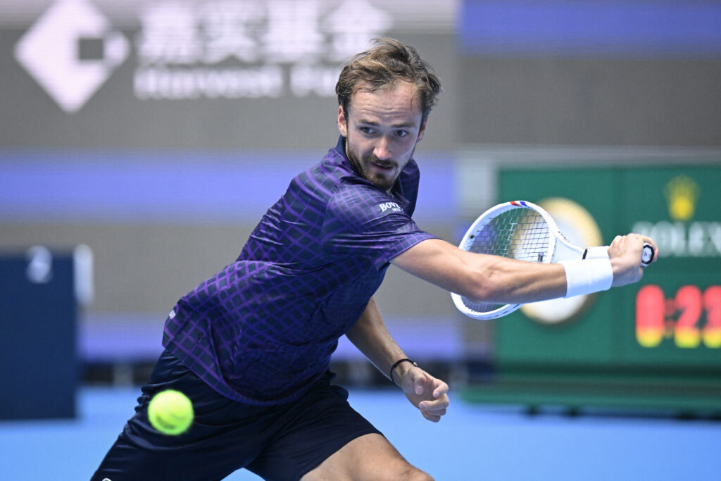 Russia's Daniil Medvedev hits a return against Britain's Cameron Norrie during their men's singles match at the China Open tennis tournament in Beijing on September 26, 2025.