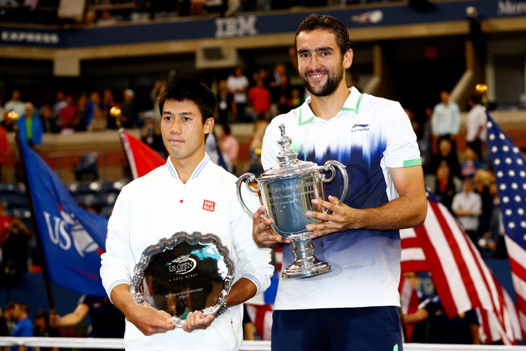 (L-R) Kei Nishikori of Japan and Marin Cilic of Croatia pose with trophies after the men's singles final match on Day fifteen of the 2014 US Open at the USTA Billie Jean King National Tennis Center on September 8, 2014 in the Flushing neighborhood of the Queens borough of New York City. Cilic defeated Nishikori by a score of 6-3, 6-3, 6-3.