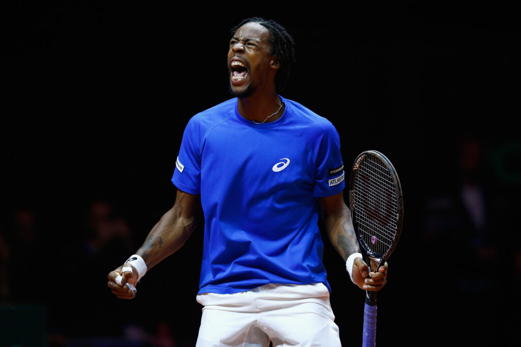 Gael Monfils of France celebrates winning a game against Roger Federer of Switzerland during day one of the Davis Cup Tennis Final between France and Switzerland at the Stade Pierre Mauroy on November 21, 2014 in Lille, France.