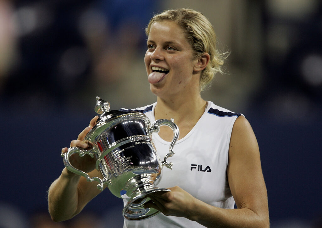 Kim Clijsters of Belgium smiles at her family box after receiving the championship trophy after defeating Mary Pierce of France in the women's final of the US Open at the USTA National Tennis Center in Flushing Meadows Corona Park on September 10, 2005 in the Flushing neighborhood of the Queens borough of New York. Clijsters defeated Pierce 6-3, 6-1.