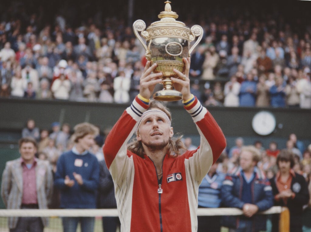 Bjorn Borg of the Sweden holds the trophy aloft after defeating Jimmy Connors of the United States during the Men's Singles Final match at the Wimbledon Lawn Tennis Championship on 8 July 1978 at the All England Lawn Tennis and Croquet Club in Wimbledon in London, England.