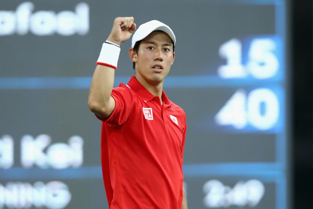 Kei Nishikori of Japan celebrates match point to win the singles bronze medal match against Rafael Nadal of Spain on Day 9 of the Rio 2016 Olympic Games at the Olympic Tennis Centre on August 14, 2016 in Rio de Janeiro, Brazil.
