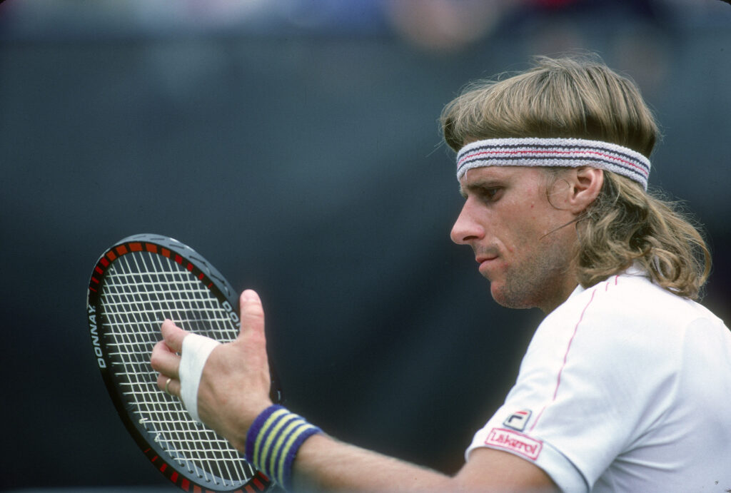 Bjorn Borg of Sweden checks the strings in his racket during a match at the Men's 1981 US Open Tennis Championships circa 1981 at the National Tennis Center in the Queens borough of New York City.