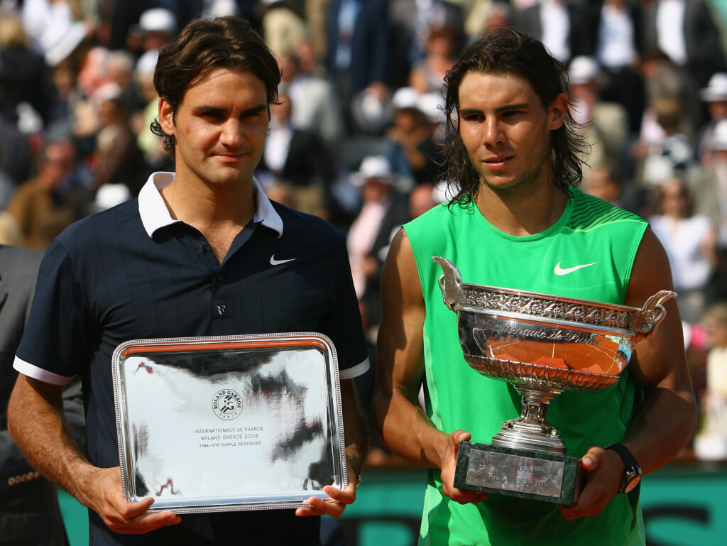 Roger Federer and Rafael Nadal with their trophies at the Roland Garros 2008 final