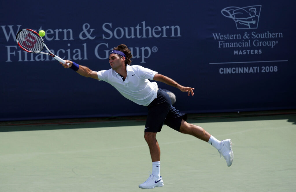 Roger Federer of Switzerland returns a shot to Ivo Karlovic of Croatia during the Western & Southern Financial Group Masters at Lindner Family Tennis Center on July 31, 2008 in Cincinnati, Ohio.