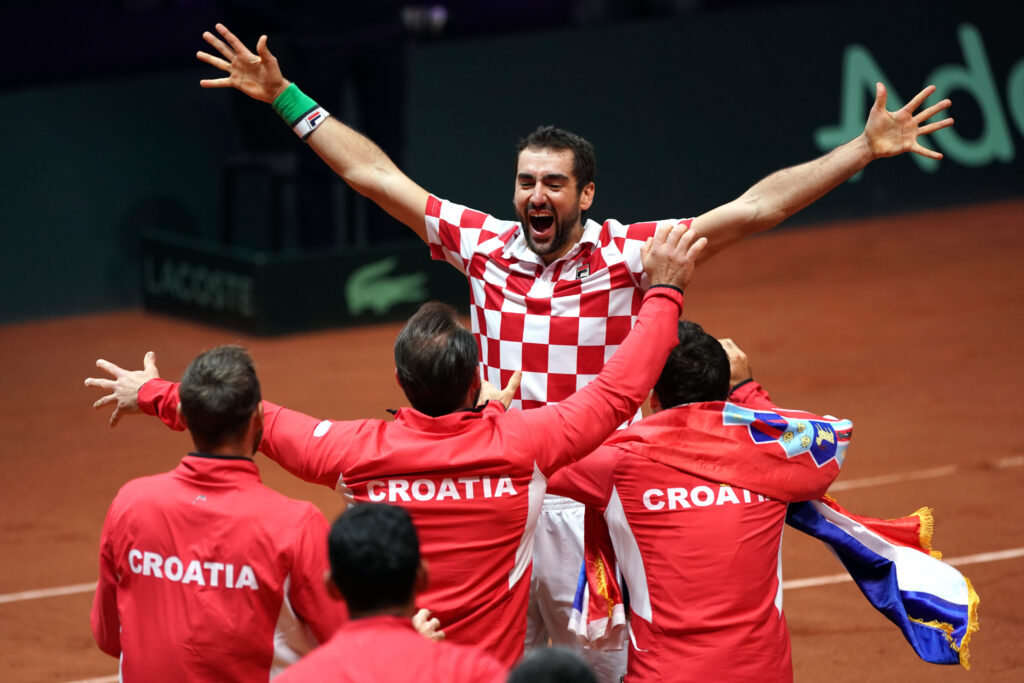 Croatia's Marin Cilic celebrates with team mates winning the Davis Cup following victory in his match against France's Lucas Pouille during day 3 of Davis Cup final at Stade Pierre Mauroy on November 25, 2018 in Lille, France.