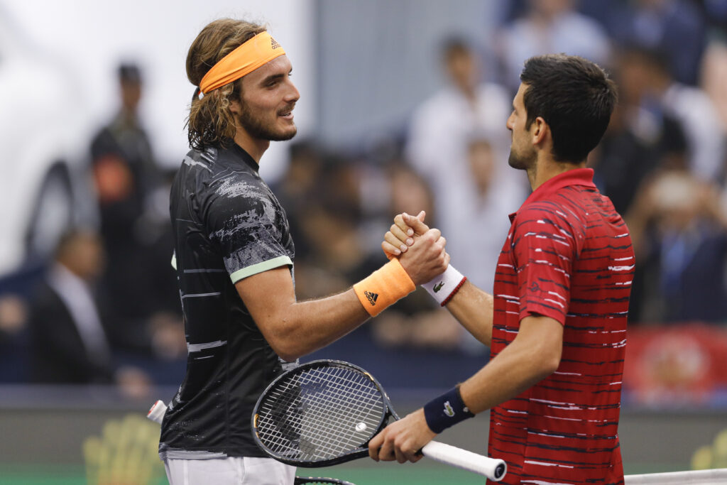 Stefanos Tsitsipas of Greece shakes hands with against Novak Djokovic of Serbia during the Men's singles Quarterfinals match of 2019 Rolex Shanghai Masters day seven at Qi Zhong Tennis Centre on October 11, 2019 in Shanghai, China.