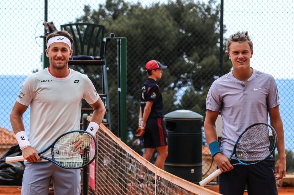 Norway's Casper Ruud poses for a photograph with Denmark's Holger Rune prior to the start of thei first round singles match on day three of the Monte-Carlo ATP 1000 Masters Series tennis tournament in Monte-Carlo, Monaco on April 13, 2021.