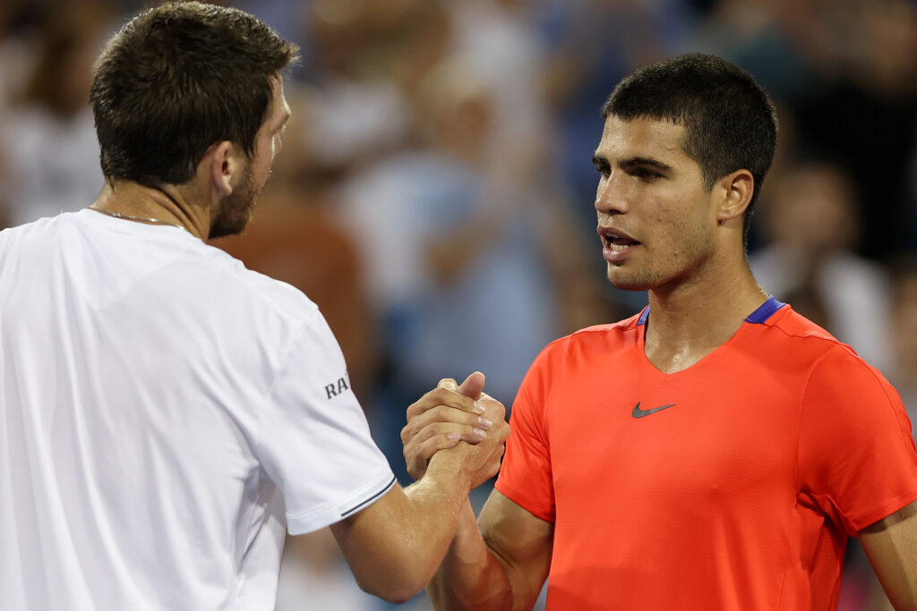 Cameron Norrie of Great Britain celebrates is congratulated at the net by Carlos Alcaraz of Spain during the Western & Southern Open at Lindner Family Tennis Center on August 19, 2022 in Mason, Ohio.