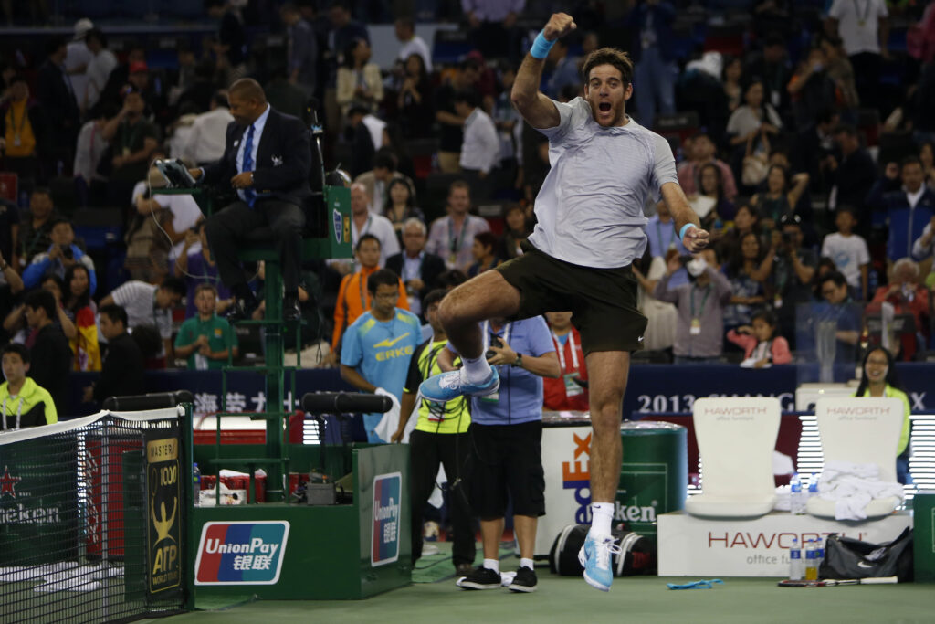 Juan Martin Del Potro of Argentina celebrates after defeating Rafael Nadal of Spain during the semi-final match on day six of the Shanghai Rolex Masters at the Qi Zhong Tennis Center on October 12, 2013 in Shanghai, China.
