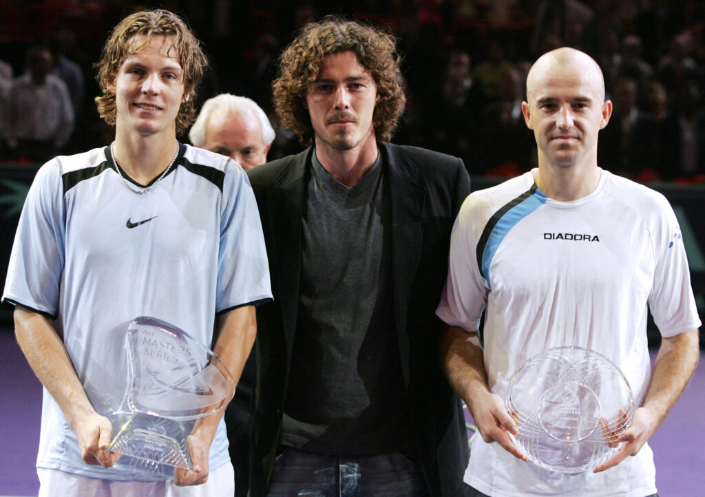 Tomas Berdych of the Czech Republic (L) holds his trophy after winning over Ivan Ljubicic of Croatia (R) at the end of their Paris Tennis Masters Series final match at Bercy indoor tournament, O6 November 2005. Berdych won 6-3, 6-4, 3-6, 4-6, 6-4.