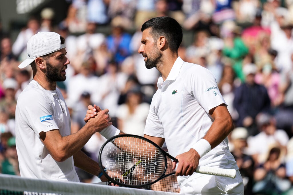 Novak Djokovic (R) of Serbia greets Jacob Fearnley of United Kingdom after their Men's Singles Second Round match during day four of The Championships Wimbledon 2024 at All England Lawn Tennis and Croquet Club on July 04, 2024 in London, England.