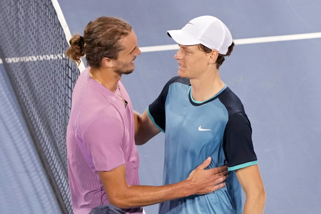 Alexander Zverev of Germany (L) and Jannik Sinner of Italy embrace after Sinner won their match 7-6, 5-7, 7-6 during Day 8 of the Cincinnati Open at the Lindner Family Tennis Center on August 18, 2024 in Mason, Ohio.