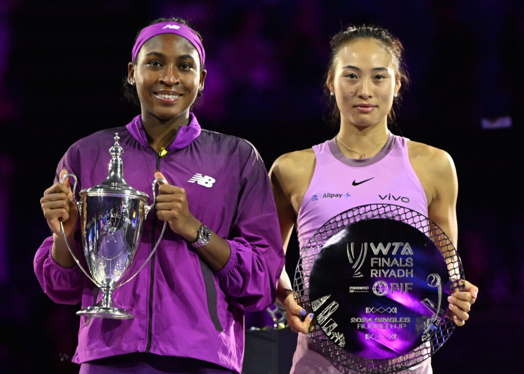 Coco Gauff of the United States and Qinwen Zheng of China pose at the Awards Ceremony during the Singles Final at King Saud University Indoor Arena of the WTA Finals Riyadh as part of the Hologic WTA Tour 2024, on November 09, 2024, in Riyadh, Saudi Arabia.
