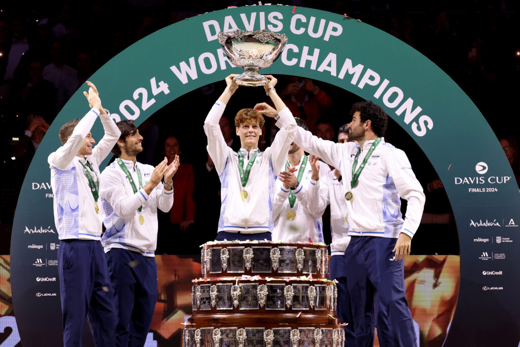 Filippo Volandri, Jannik Sinner, Lorenzo Musetti, Matteo Berrettini, Andrea Vavassori and Simone Bolelli of Italy lift the Davis Cup Trophy after their teams victory during the Davis Cup Final match against Netherlands during the Davis Cup Finals at Palacio de Deportes Jose Maria Martin Carpena on November 24, 2024 in Malaga, Spain.