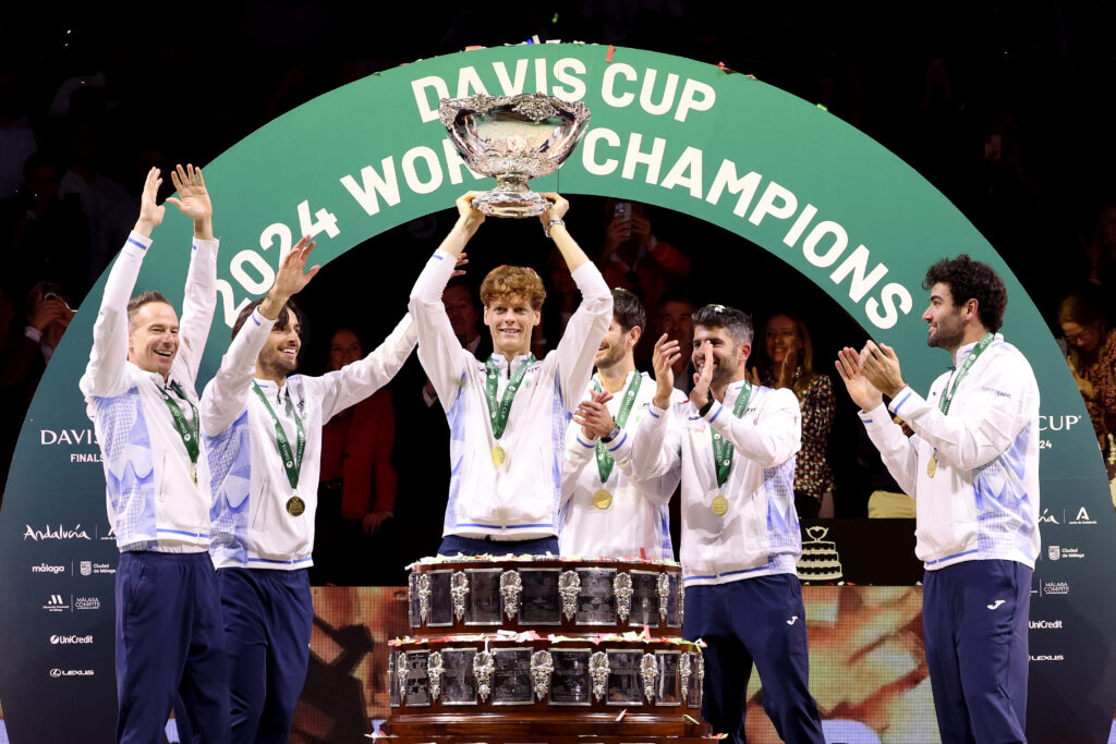 Filippo Volandri, Jannik Sinner, Lorenzo Musetti, Matteo Berrettini, Andrea Vavassori and Simone Bolelli of Italy lift the Davis Cup Trophy after their teams victory during the Davis Cup Final match against Netherlands during the Davis Cup Finals at Palacio de Deportes Jose Maria Martin Carpena on November 24, 2024 in Malaga, Spain.