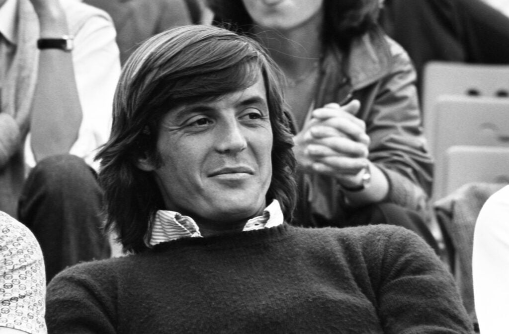 Portrait of Italian tennis player Adriano Panatta in the stands of the French Open in May 1979.